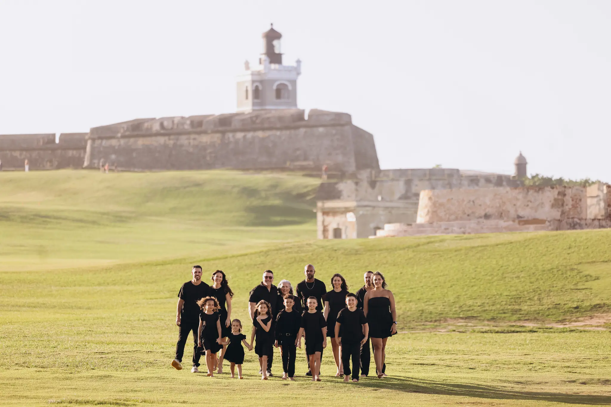 Large family group on the lawn near El Morro in Old San Juan, Puerto Rico, photographed by Olga Thomas