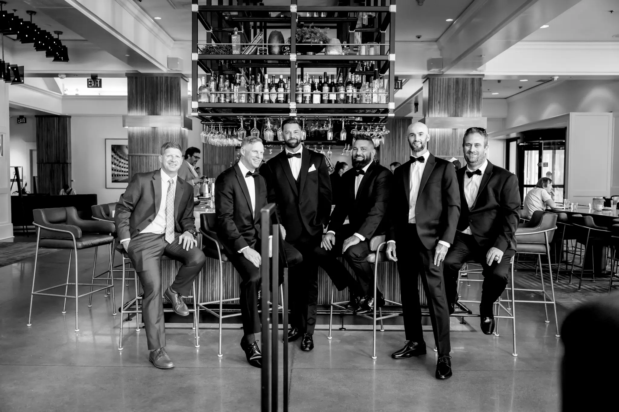 Black-and-white indoor groomsmen portrait