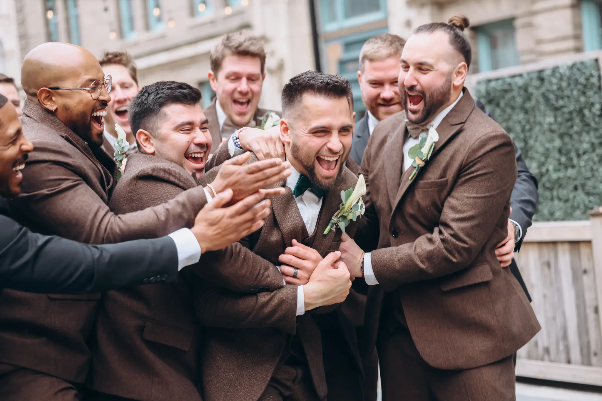 Groomsmen gathered outdoors in formal suits