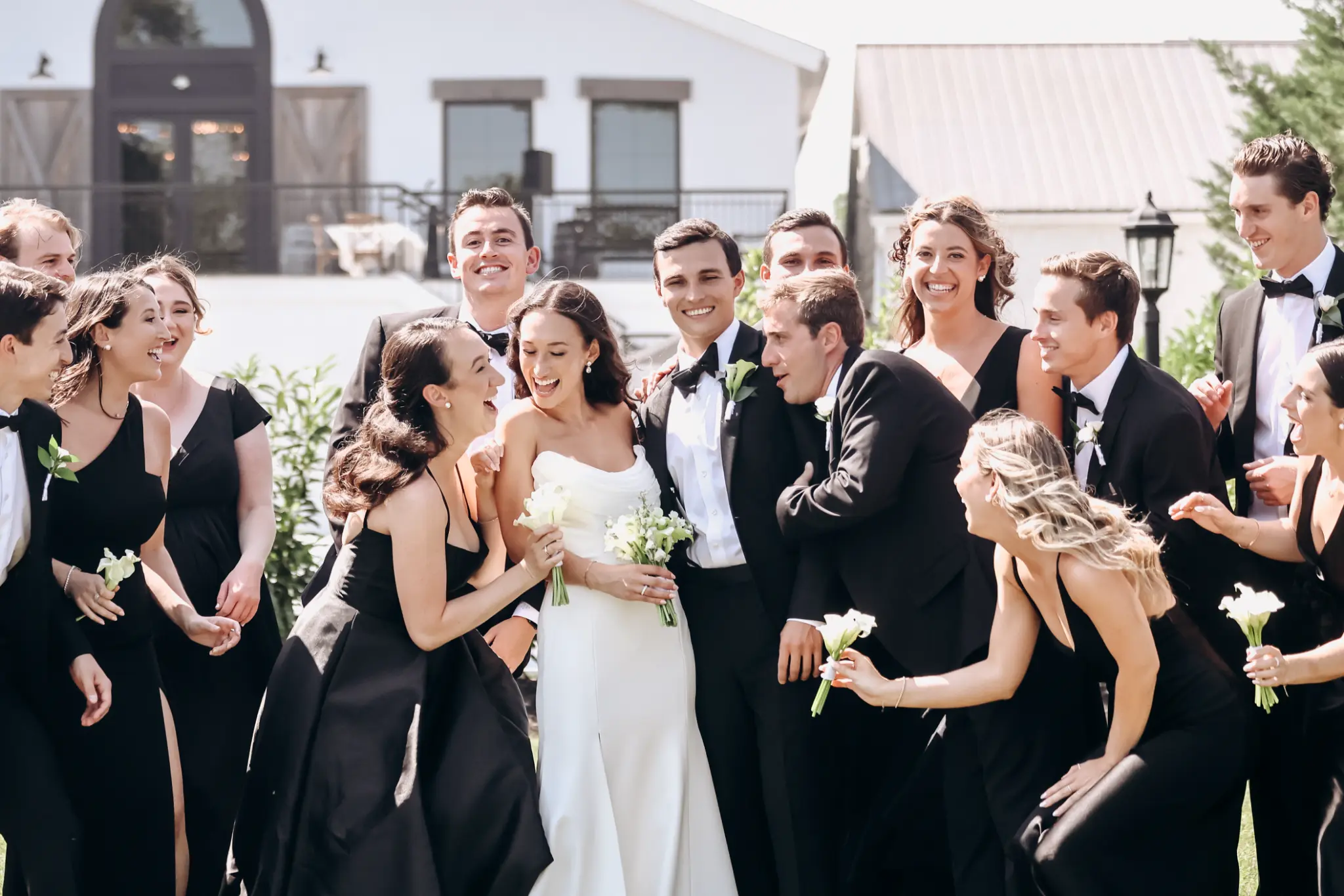 Wedding party gathered outdoors in formal attire