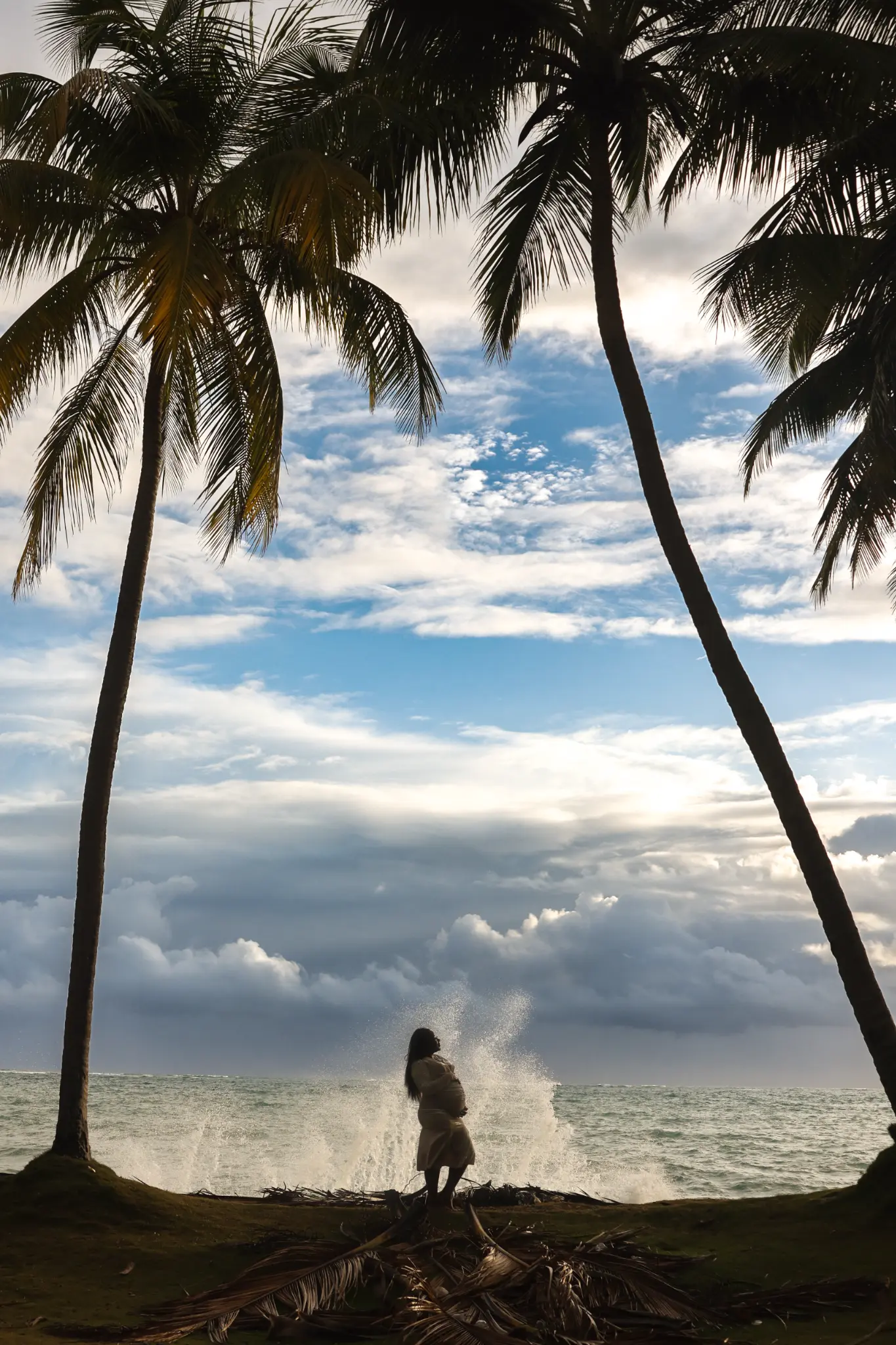 Child near gentle waves during a relaxed Puerto Rico beach family session, photographed by Olga Thomas