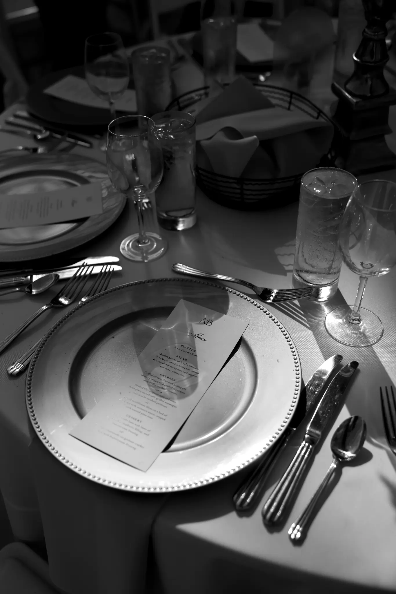 Black-and-white formal place setting and reception table detail