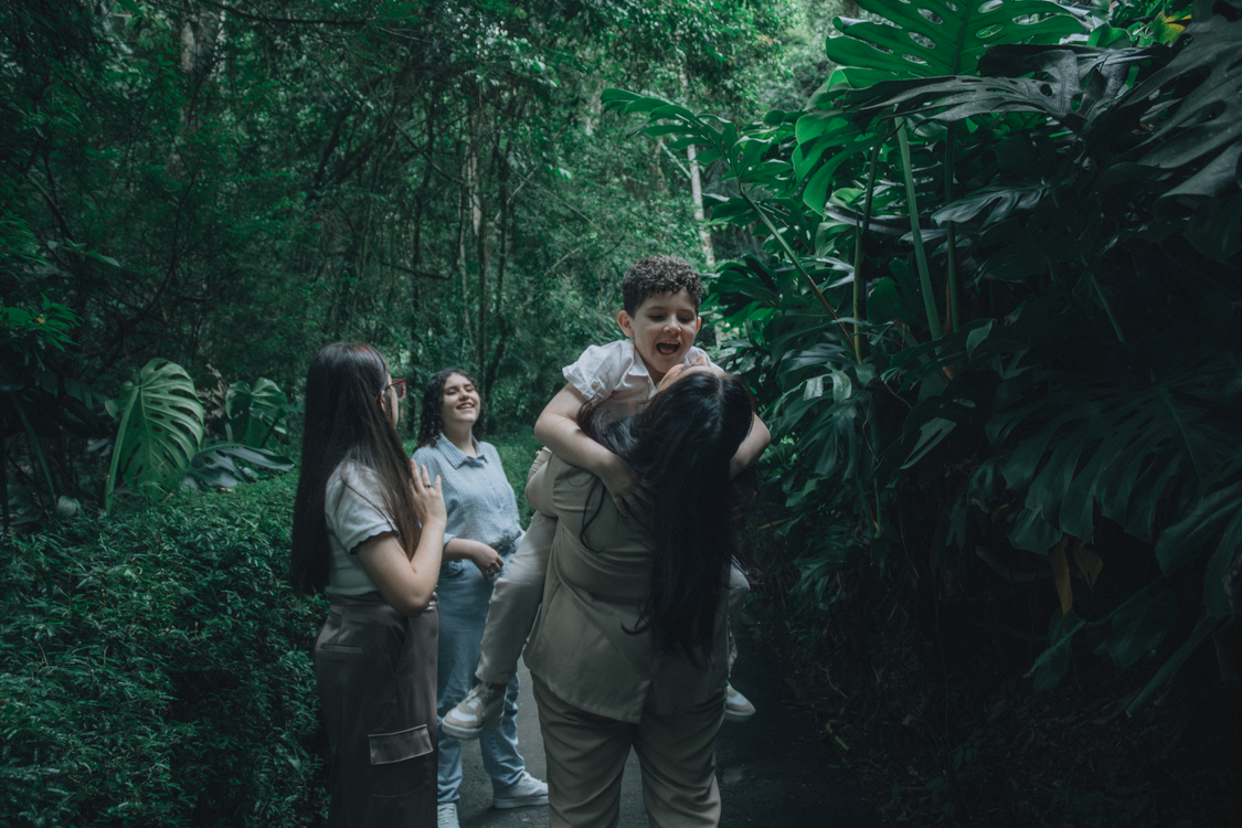 Illustrative family walking together through a lush green tropical forest